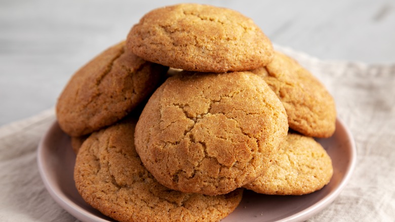 plate of stacked snickerdoodle cookies