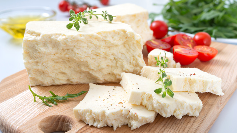 cheese on board with tomatoes