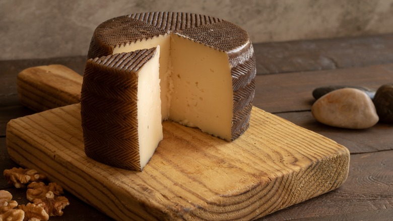 Manchego cheese on a board