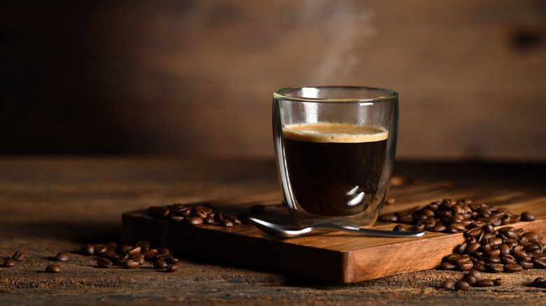 Steaming glass of espresso