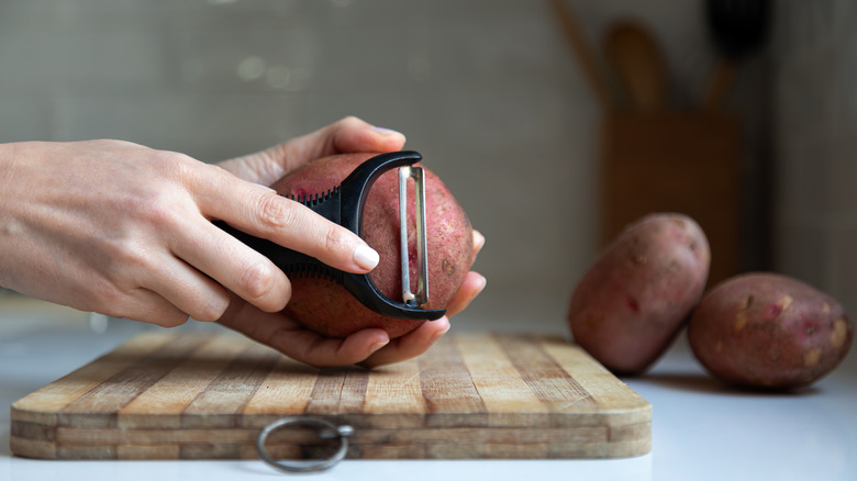 Potato being peeled