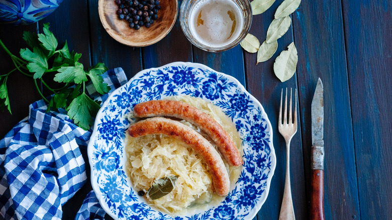 Bratwurst with sauerkraut on table