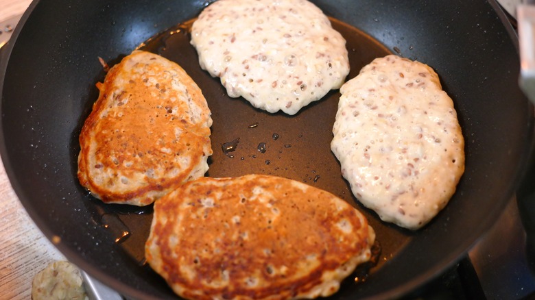 pancakes frying in a skillet