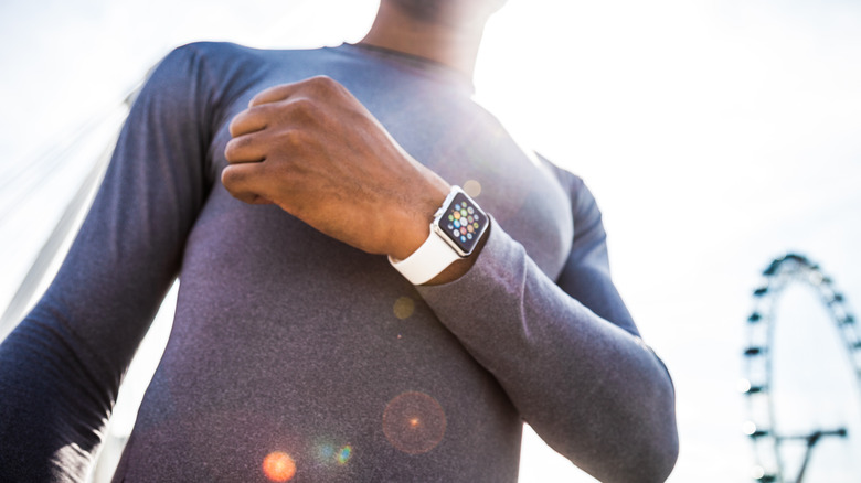 person wearing Apple Watch