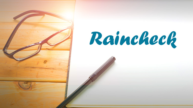 raincheck slip with glasses and pen