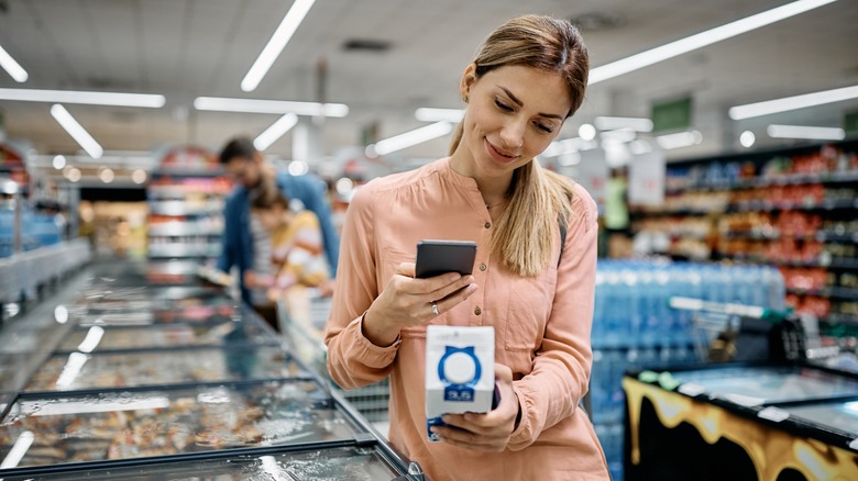 person scanning product with phone