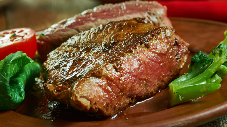 Pittsburgh-style steak on plate, with vegetables