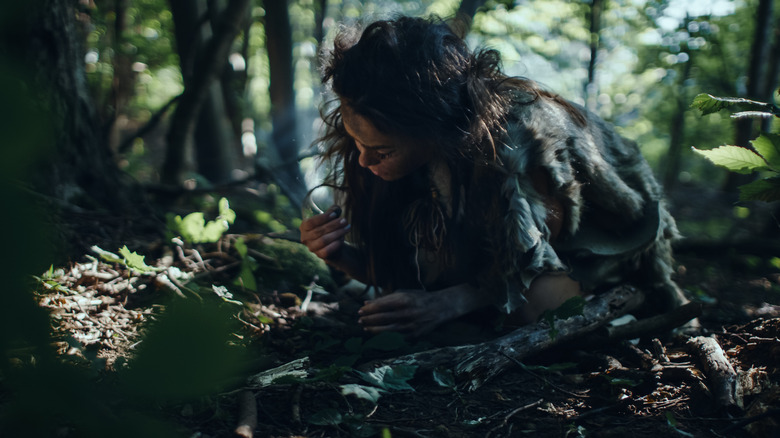 Ancient woman picking blueberries