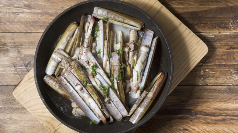 Cooked razor clams in broth