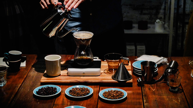 Barista trying different coffee blends