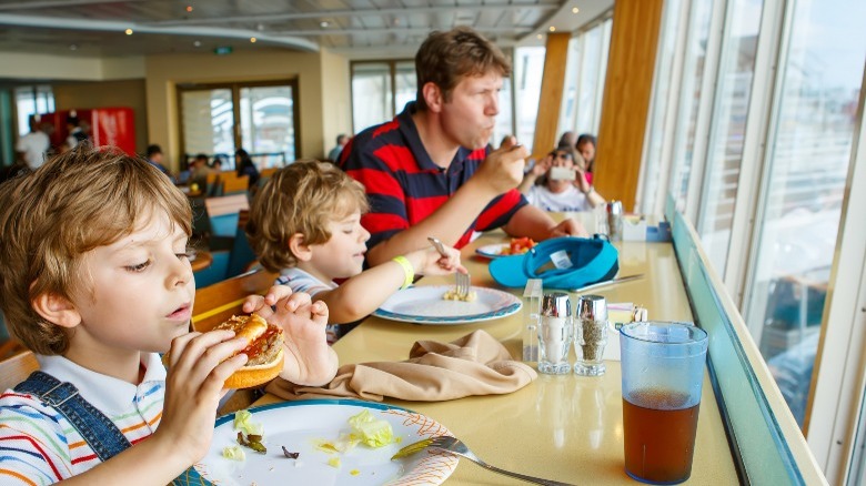 Dad and kids eating on cruise ship