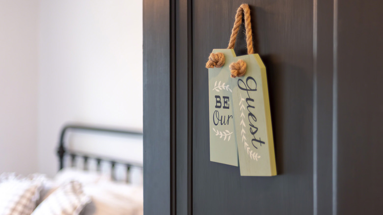 hanging sign on bedroom door