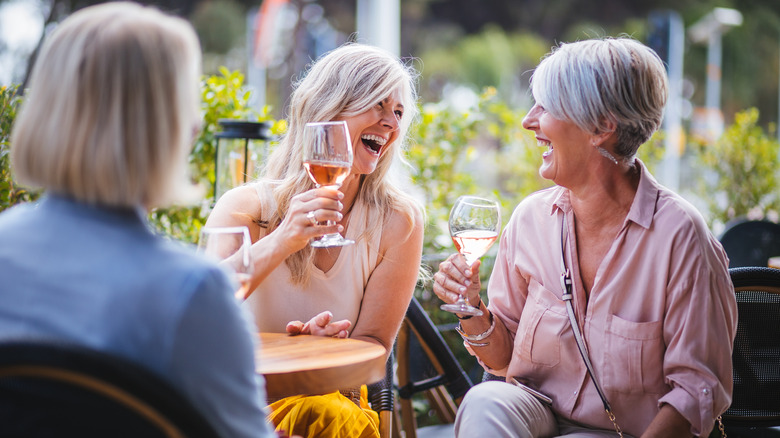 Women enjoying wine outside