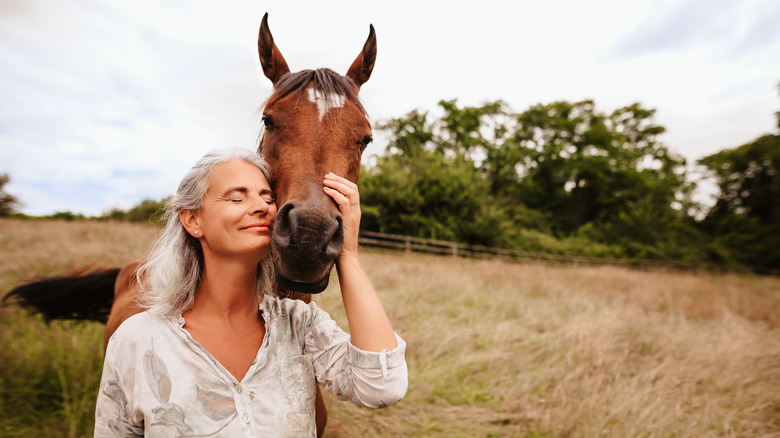 Woman hugging a horse