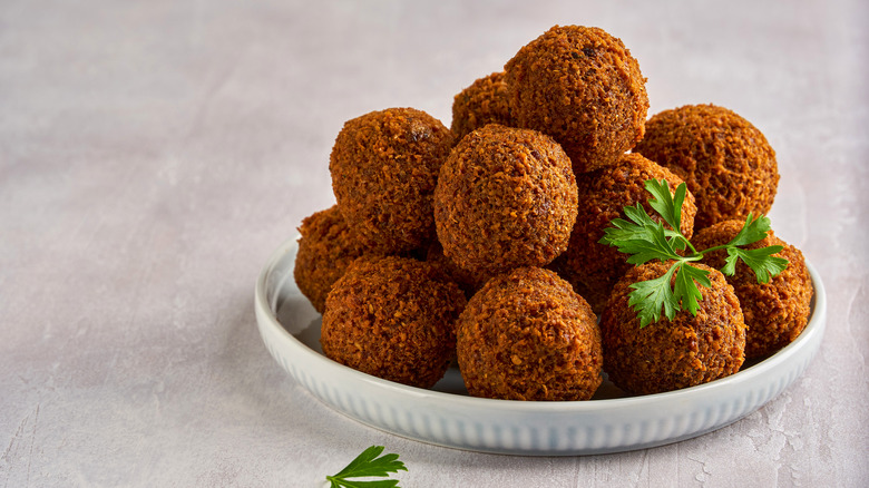 Falafel stacked on a dish