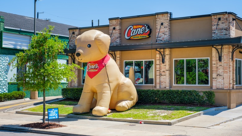 large inflated raising cane dog