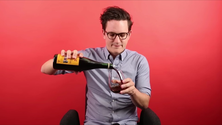 Man pouring Buckfast