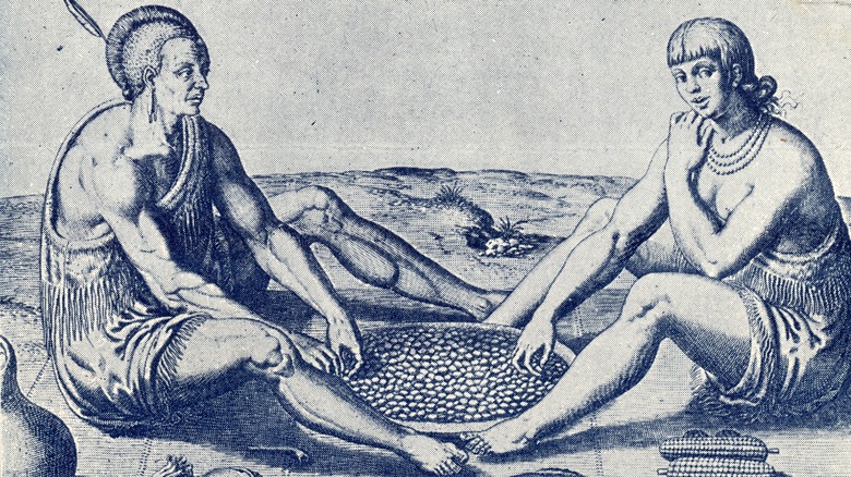 Native Americans eating maize