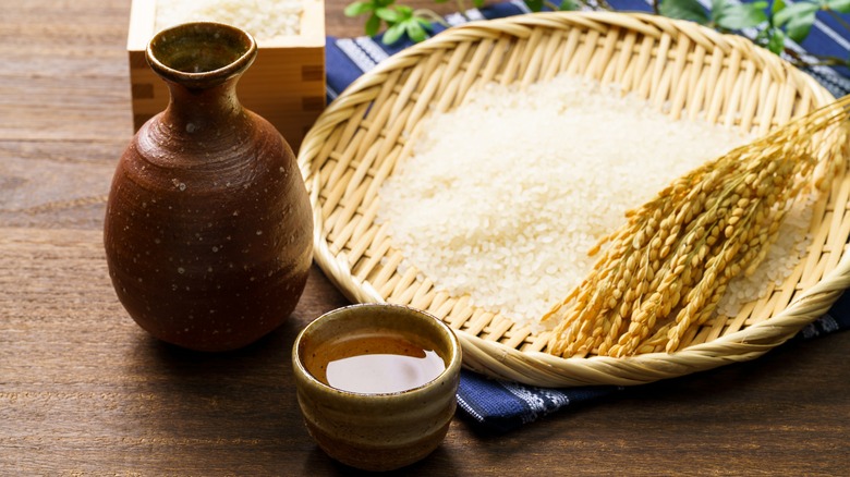 bottle and cup of sake with rice