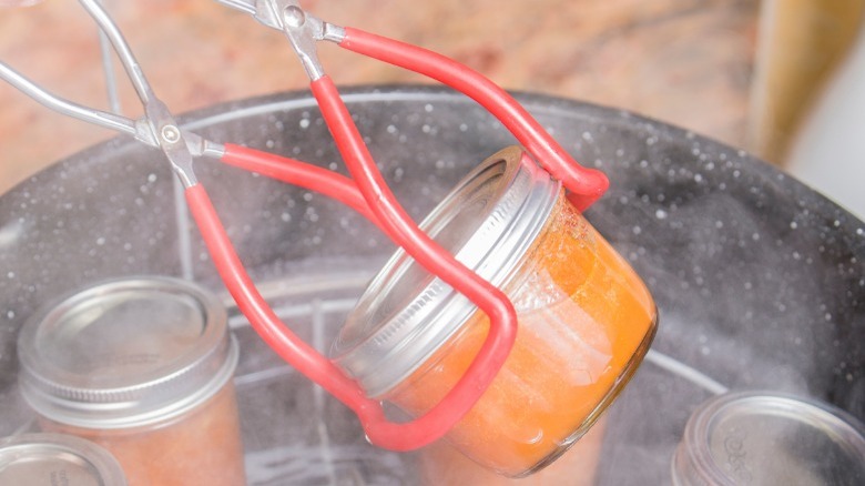 cans lifted by jar lifter