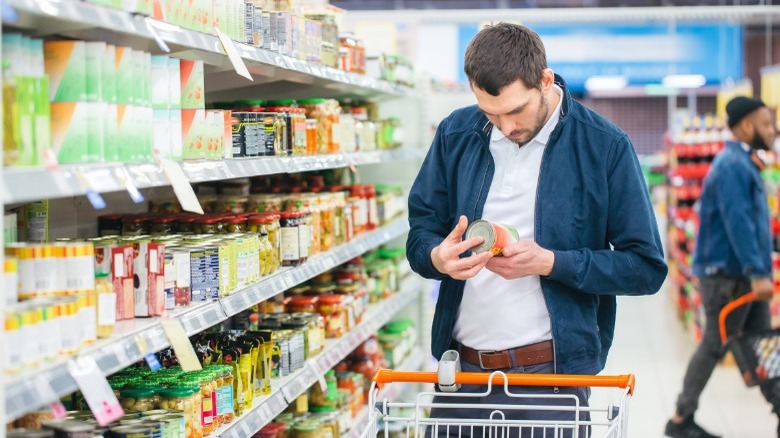 man in grocery store aisle