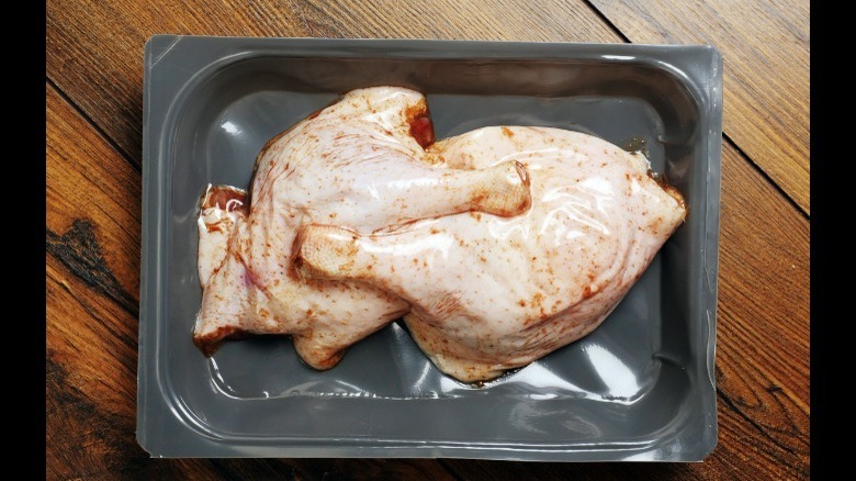 Two uncooked duck legs package