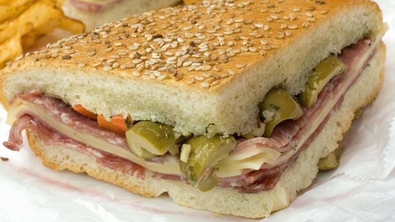 muffuletta on paper with chips