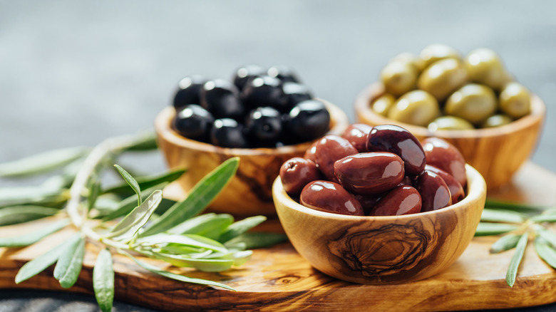 various olives in three bowls