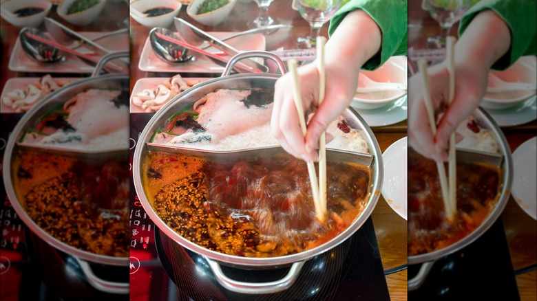 Adding ingredients to hotpot