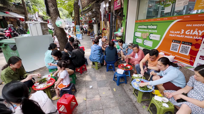 A crowd enjoying Vietnamese food