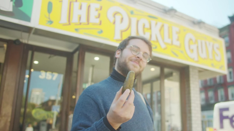 Man holding pickle