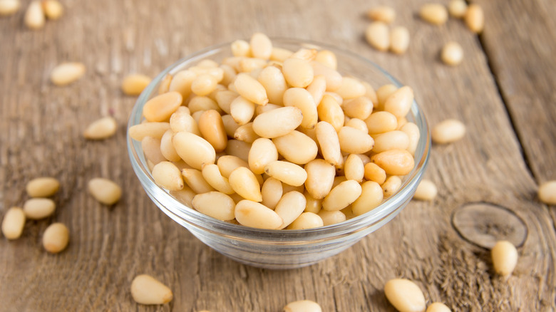 Glass bowl of pine nuts