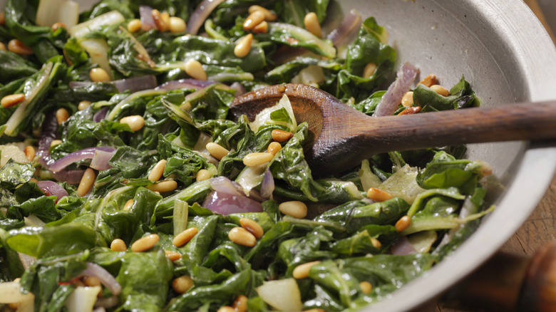 Salad topped with pine nuts