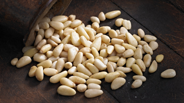 Pine nuts on wooden counter