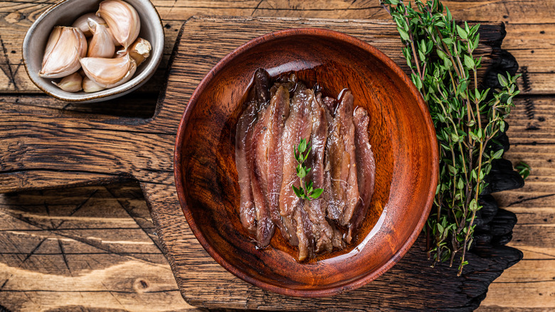 Anchovies on plate with thyme
