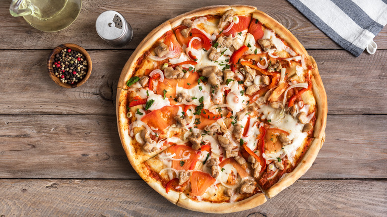BBQ chicken pizza on table