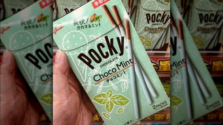 Hand holding Pocky Choco Mint