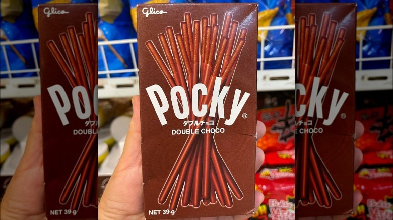 Hand holding Double Choco Pocky