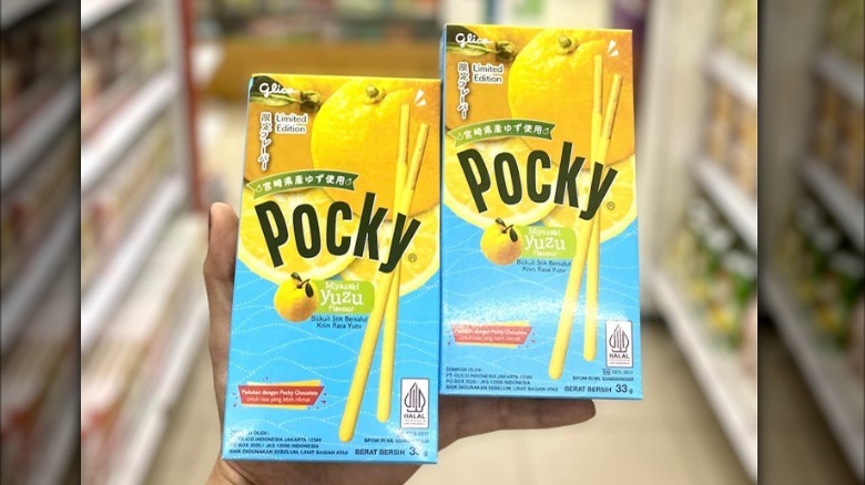 Holding pocky boxes in store