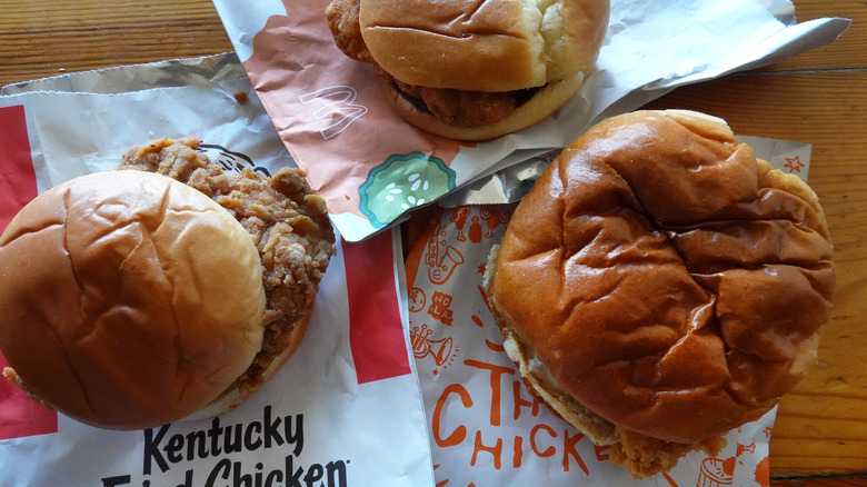 Fast food chicken sandwiches on table