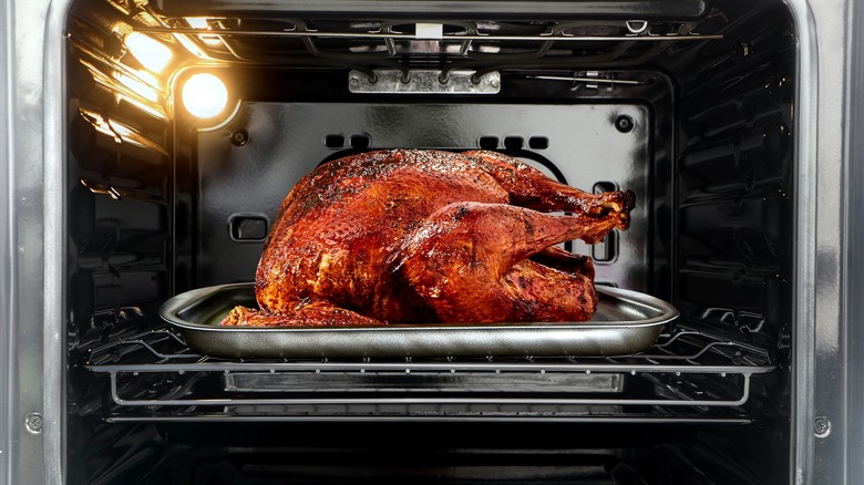 whole roast turkey in oven