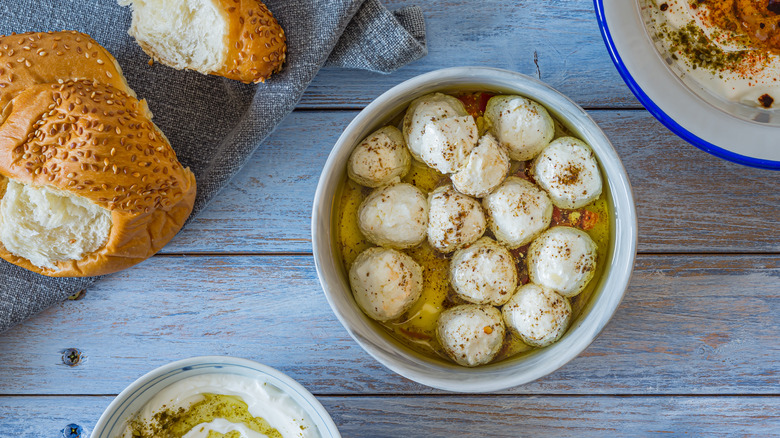 Bowl of soft labneh balls with bread