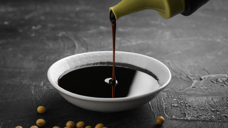 pouring sweet soy sauce