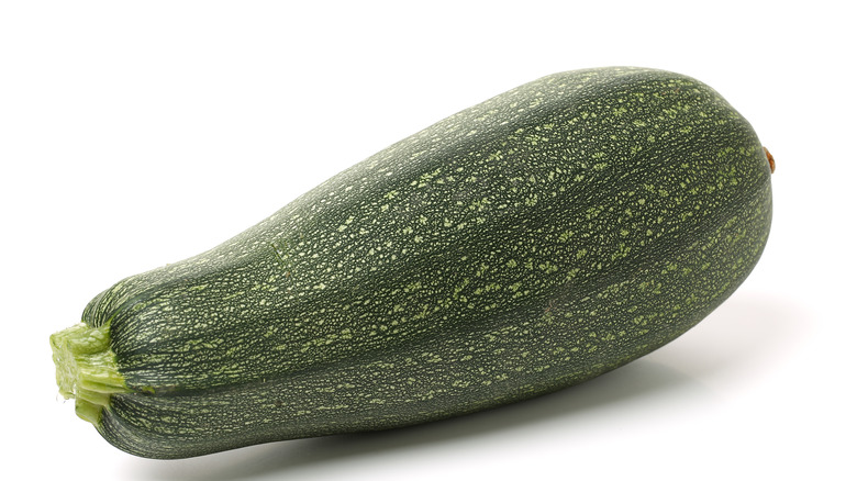 Green summer squash white background 