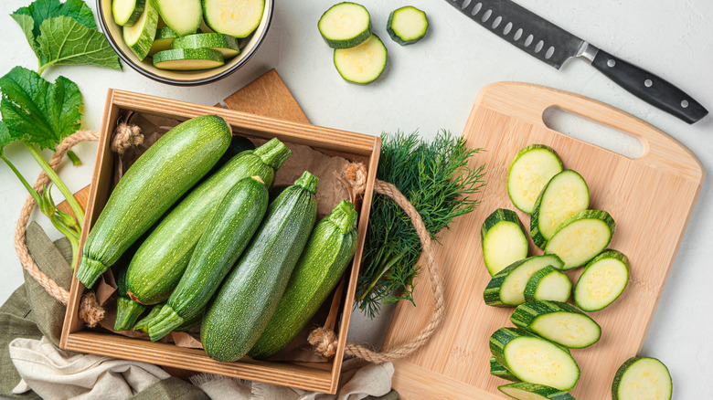 Zucchini in tray, on board