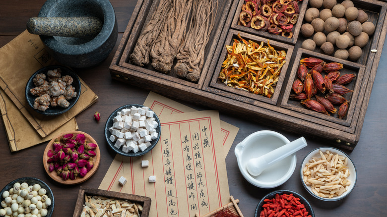 Collection of dried herbs and berries used in traditional Chinese medicine