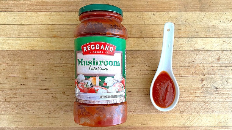 Jar and spoonful of Reggano Mushroom Pasta Sauce