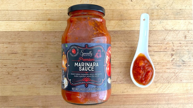 Jar and spoonful of Specially Selected Marinara Sauce