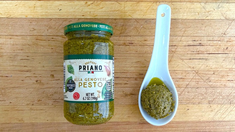 Jar and spoonful of Priano Alla Genovese Pesto