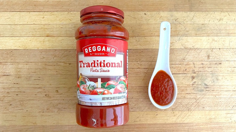 Jar and spoonful of Reggano Traditional Pasta Sauce